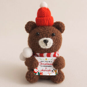 Cute crochet animals bear wearing a red hat and holding a customizable card, a perfect small crochet bear for decoration or gift