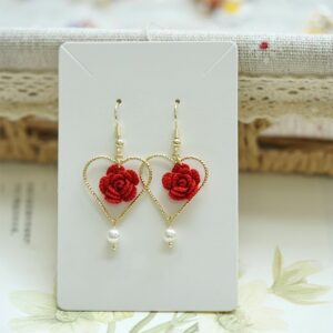 Handmade crochet drop earrings with red roses, gold heart frames, and pearl charms—perfect delicate gift for her from a mini crochet factory