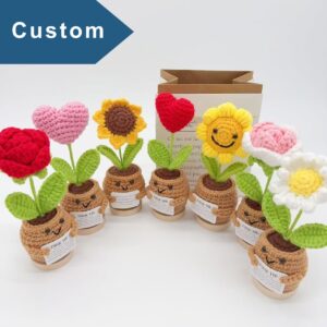 Custom crochet flowers from a crochet flower factory, featuring handmade designs in pot arrangements.
