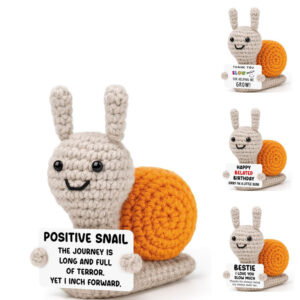 Handcrafted crochet snail doll holding a positive message sign, ideal crochet gift in bulk.
