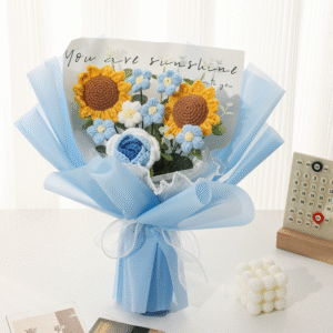 Vibrant crochet sunflower bouquet with blue and white flowers, perfect as a Valentine's gift flower.