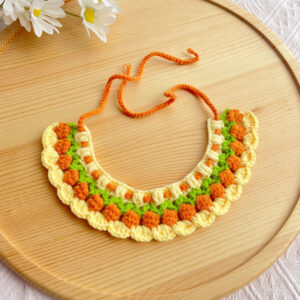 Handmade Crochet Pet Necklace with Floral Pattern Handcrafted crochet pet necklace featuring orange and green floral designs, perfect as a stylish pet accessory.